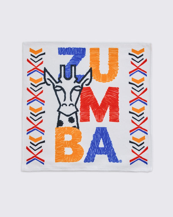 White square towel with a black embroidered giraffe outline, bold multicolor ZUMBA lettering, and red, orange, blue, and black chevron accents along both sides.