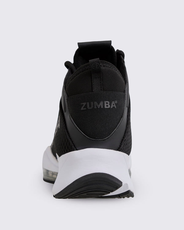 Black Zumba high-top athletic sneaker shown from the back, featuring a breathable mesh upper, pull tab, padded heel, Zumba branding, and chunky white sole with black tread.