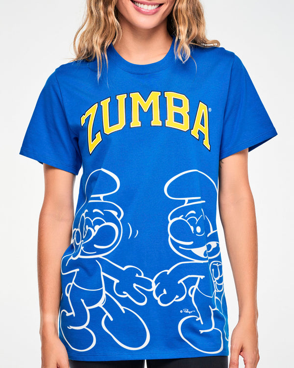 Close-up of the blue tee's front graphic: arched yellow 'ZUMBA' text over two white outline Smurfs dancing near the hem.