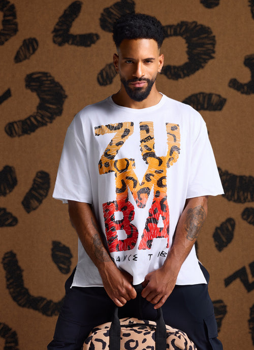 Male model wearing a white oversized Zumba T-shirt with a bold 