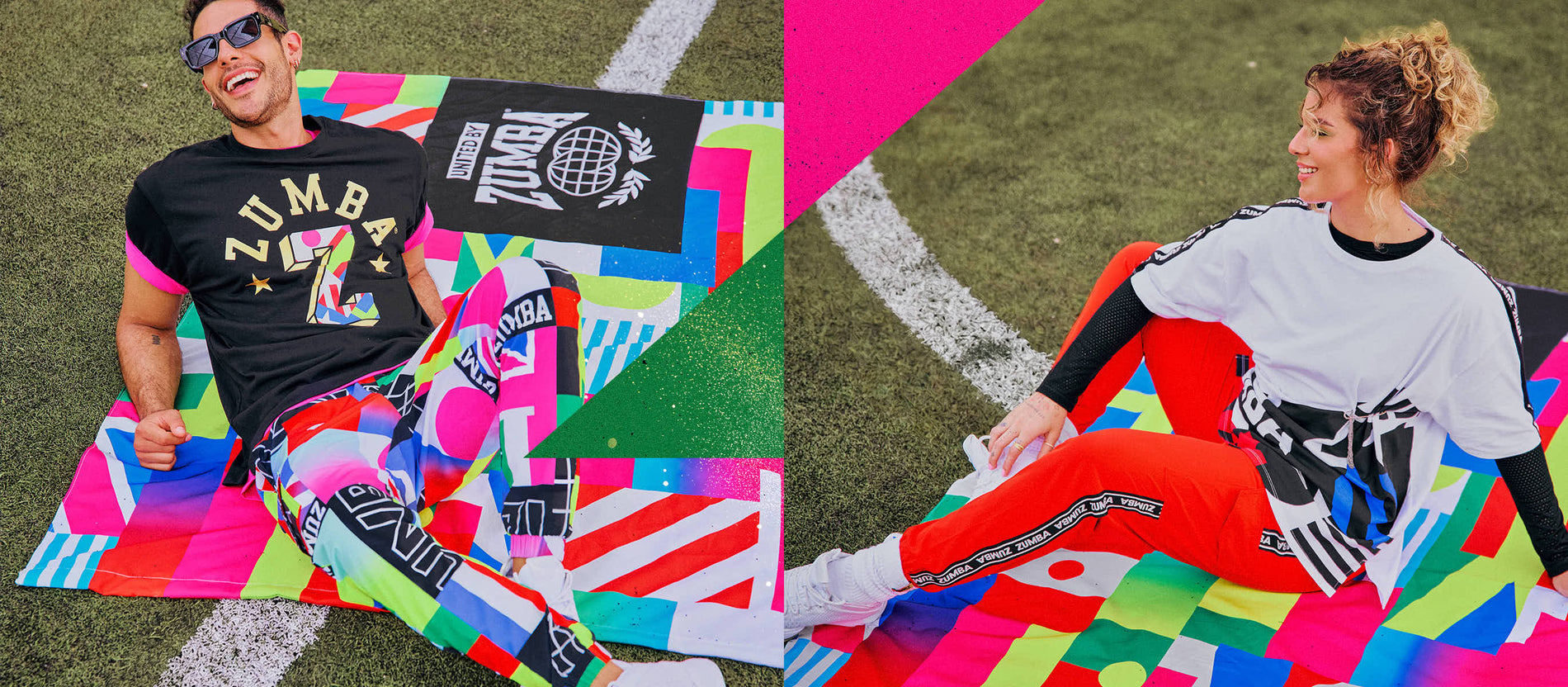 A male and a female model lounge on colorful Zumba blankets—black tee with graphic joggers and white tee with red track pants—on turf.