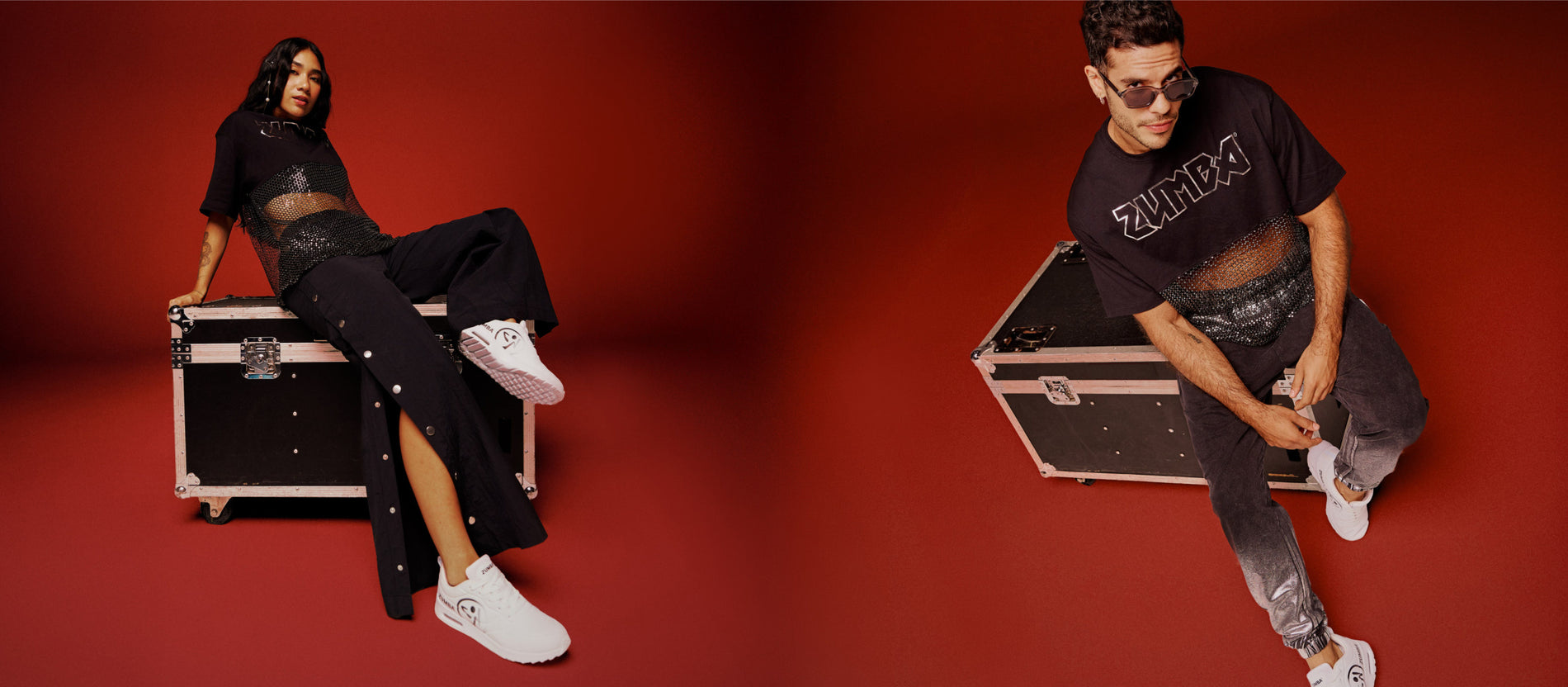 Banner of two models. On the left, female model in black Zumba activewear and white sneakers. On the right, male model in a black Zumba top, dark joggers, and white sneakers, against a red background.