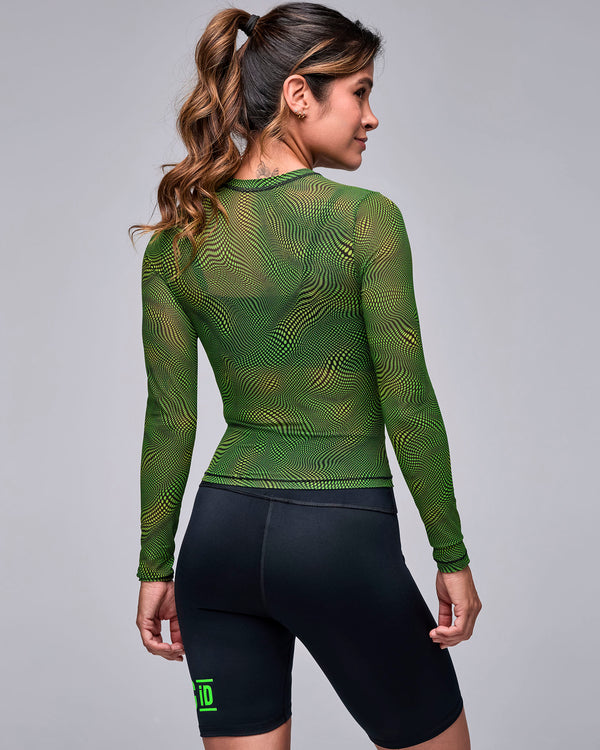 Back view of the neon green and black wavy check print mesh long sleeve top, showing the sheer back and fitted sleeves.