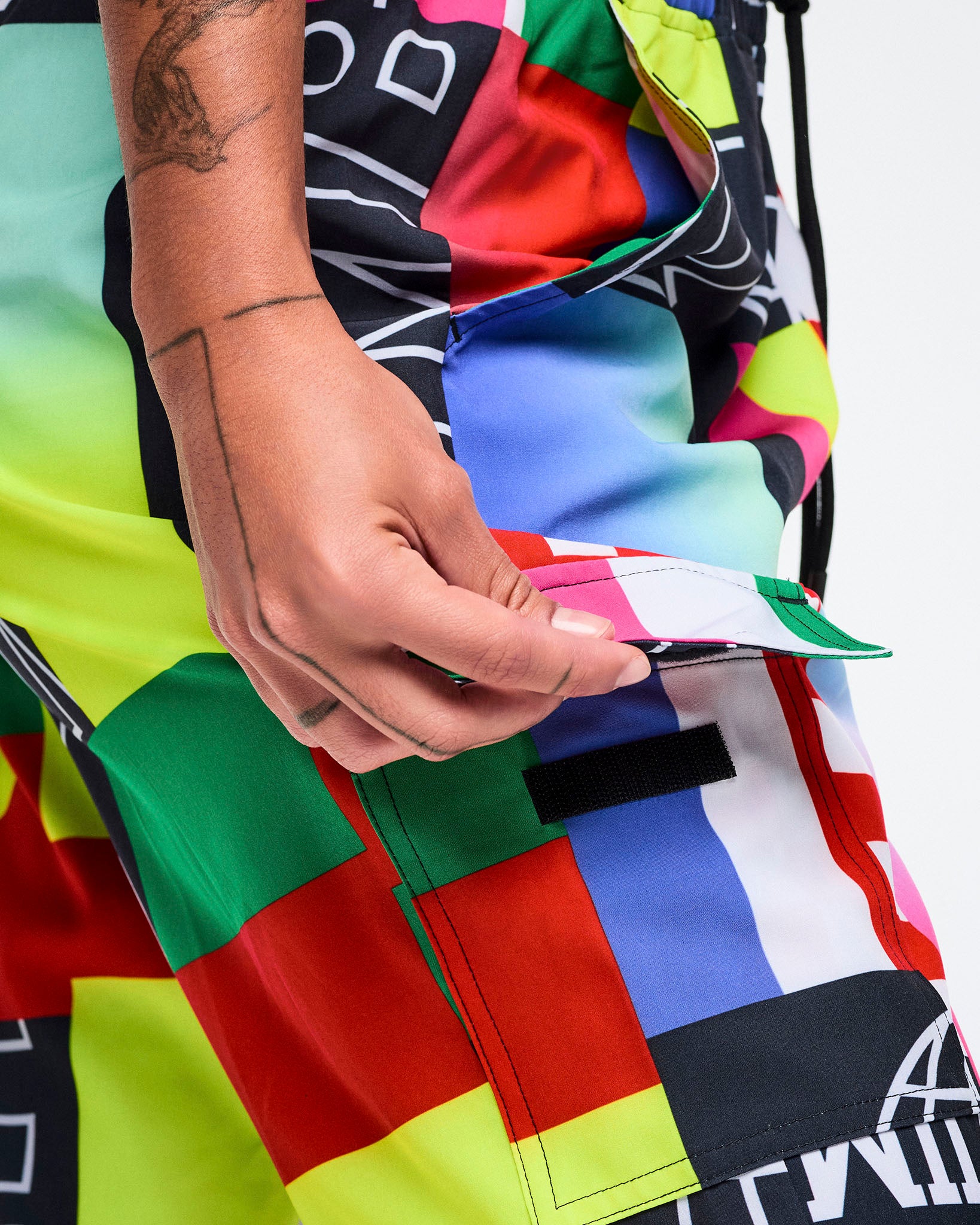 Close-up view of the opening flap on the side cargo pockets.