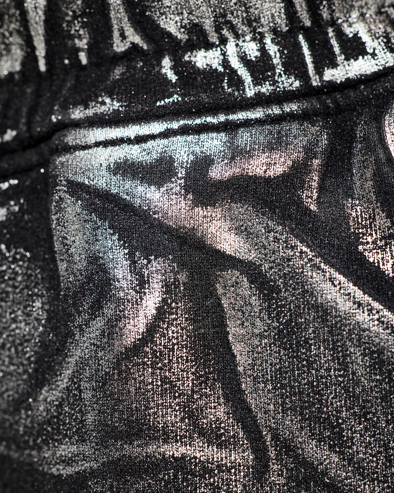Close-up of the black and silver metallic textured look used on the pants.