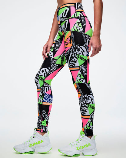Female model wearing multi-colored Zumba leggings with a geometric pattern.