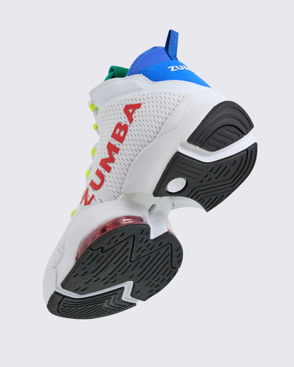 Bottom-up angle of the white Zumba high-top sneaker highlighting the black textured outsole, white sculpted midsole, red air unit, and blue heel collar, on a light gray background.