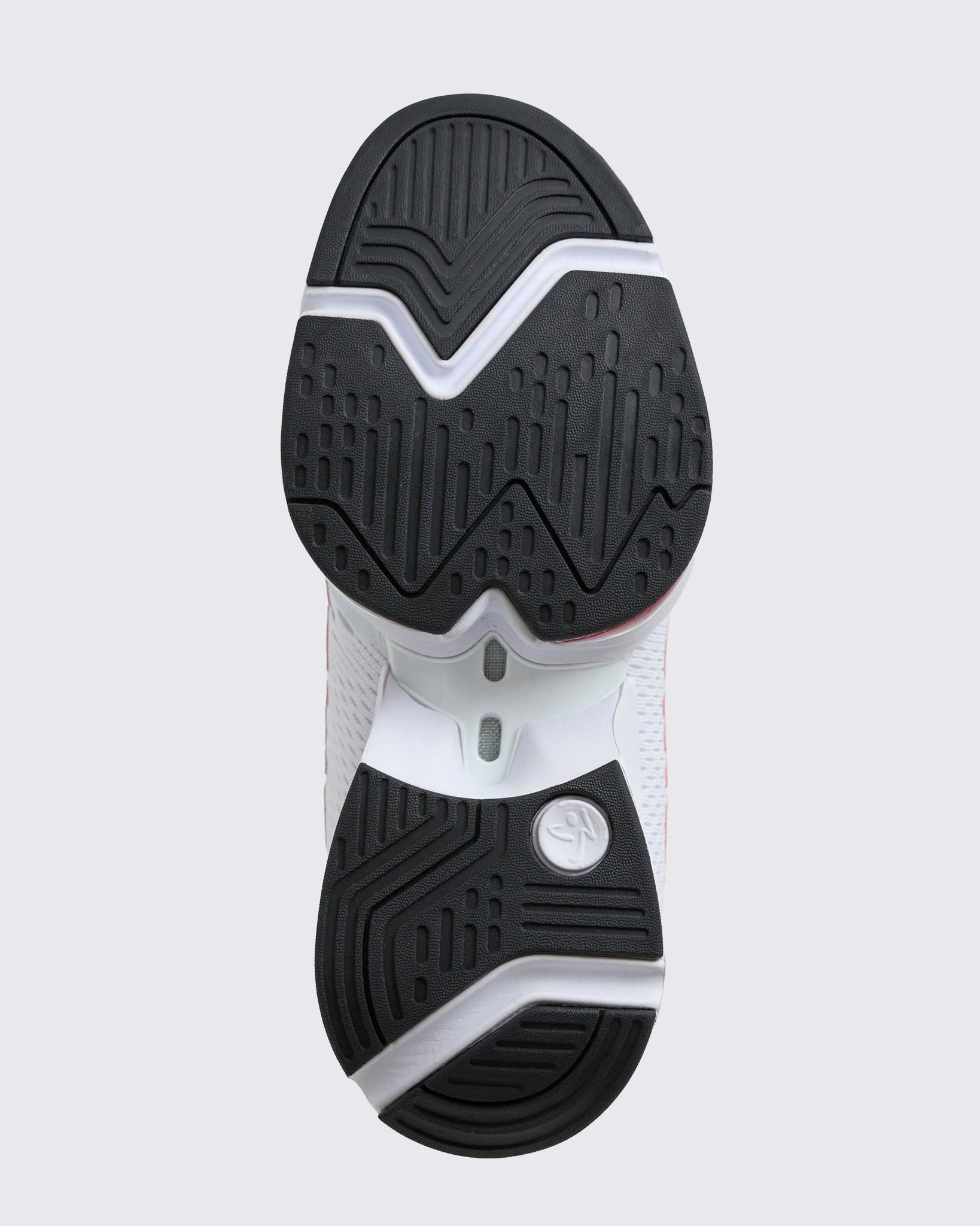 Close-up of the black rubber outsole with textured tread pattern and white midsole cutouts, shown on a light gray background.