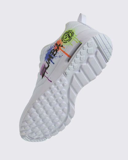 Angled view of a white Zumba sneaker with colorful design showing the patterned sole on a white background.