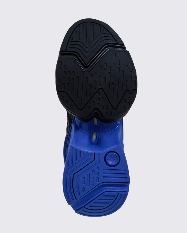 Bottom view showing split black-and-blue outsole with multidirectional traction pattern.