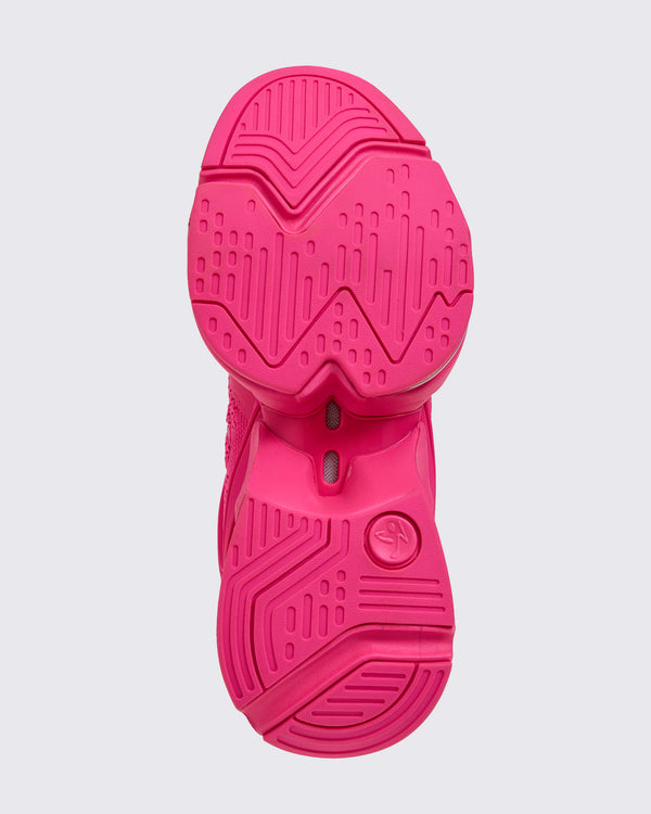 Pink sneaker sole on a light gray background.
