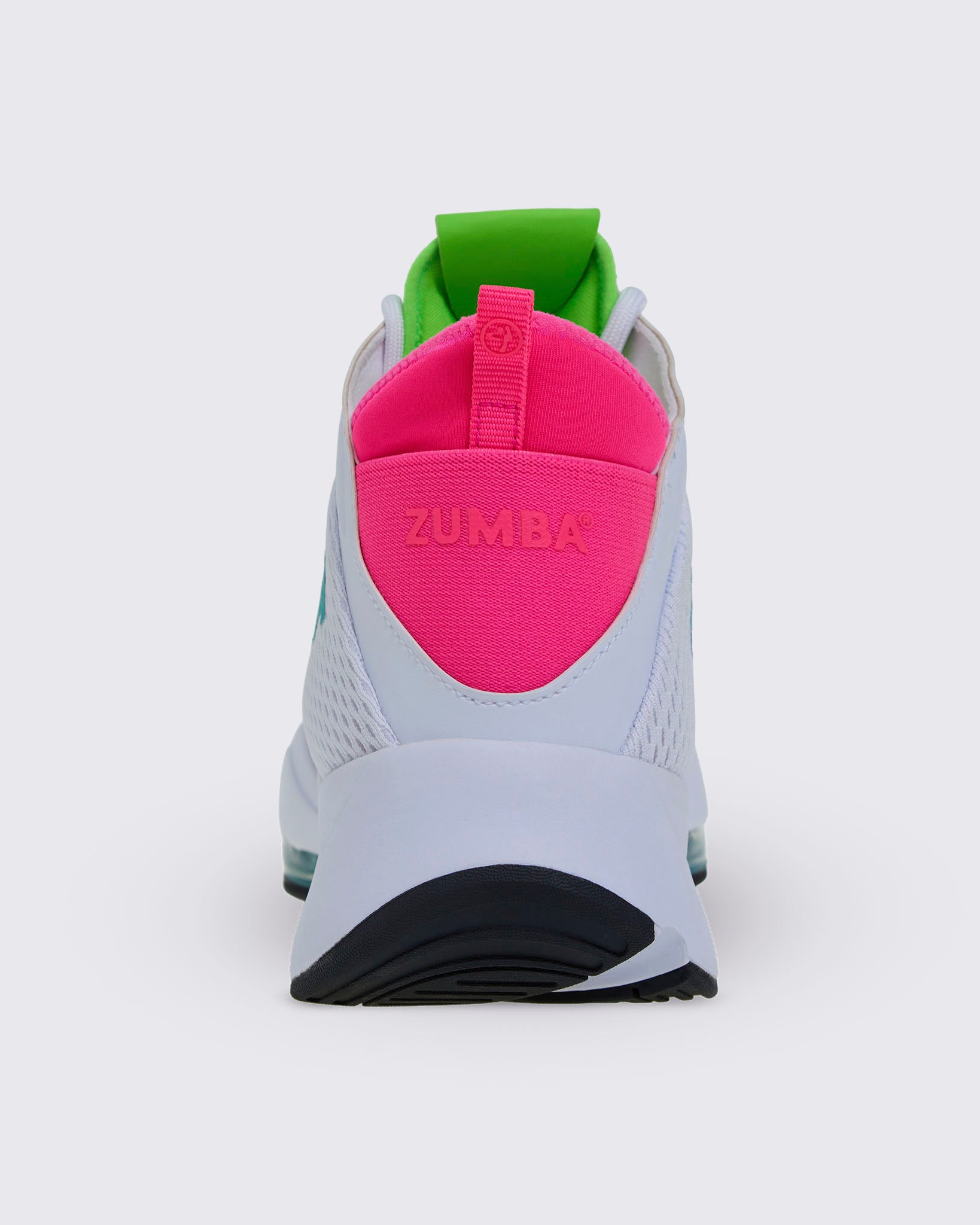Heel view of a white sneaker with pink "ZUMBA" text on the heel pull tab and a neon green tongue tab.