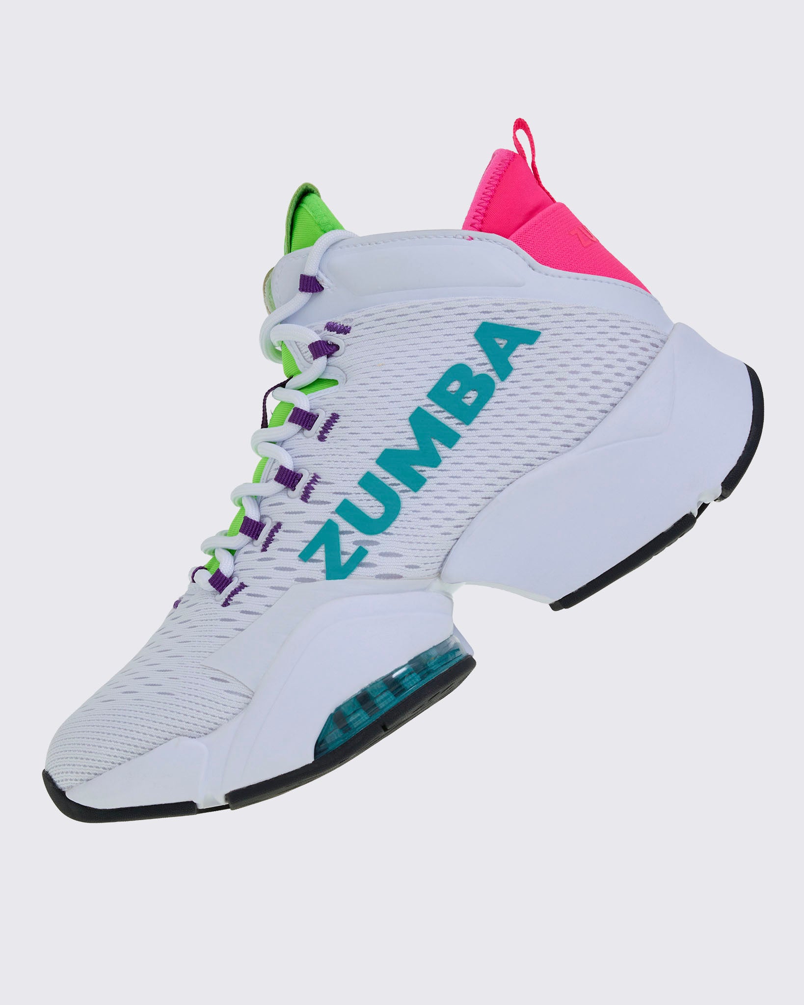 Left side view of a white sneaker, with green and purple accents and showing the aqua "ZUMBA" text across the mesh upper and a black outsole.