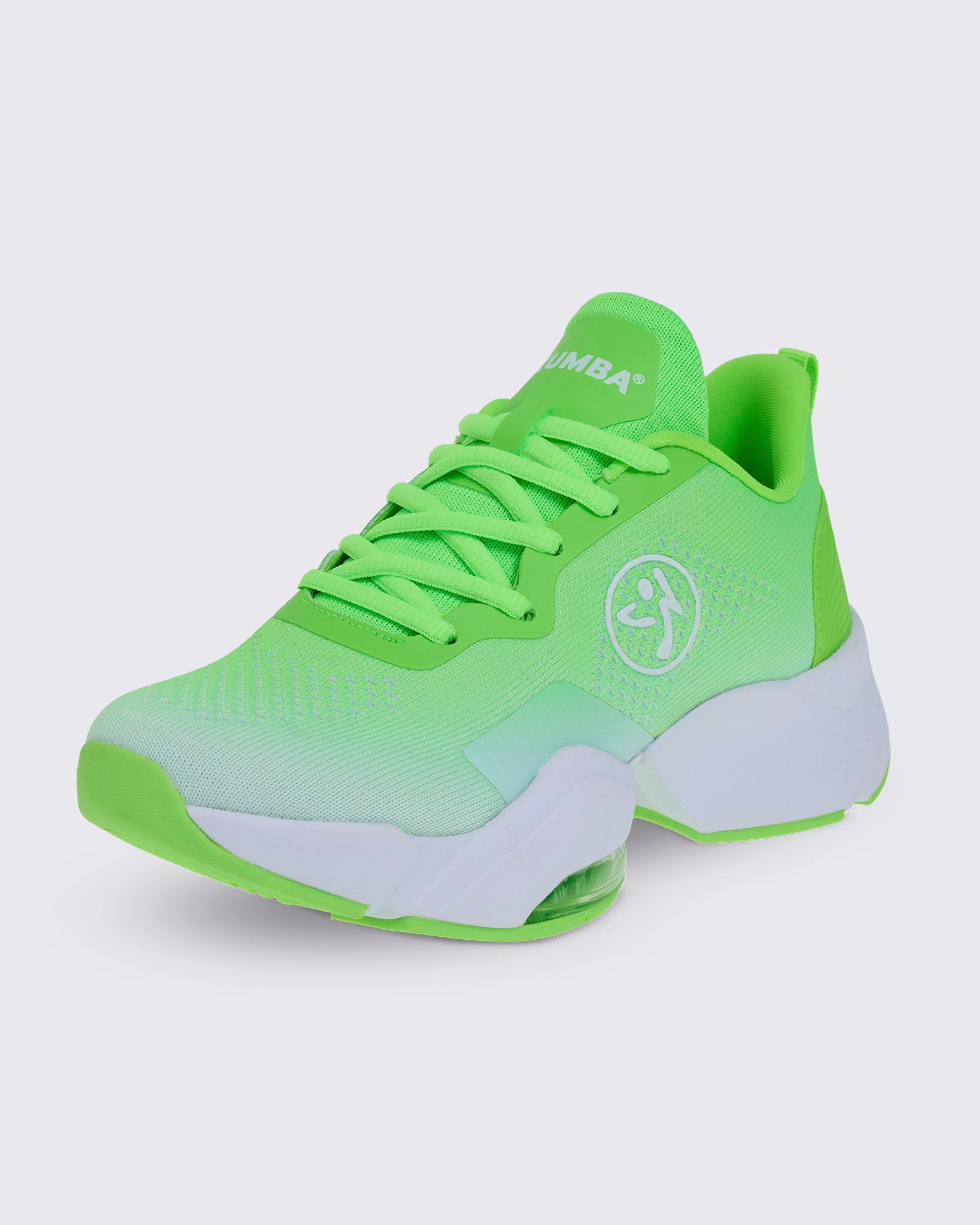 Front side view of a neon green sneaker showing white Zumba text on the tongue and a white Zumbito logo on the side with a white sole.