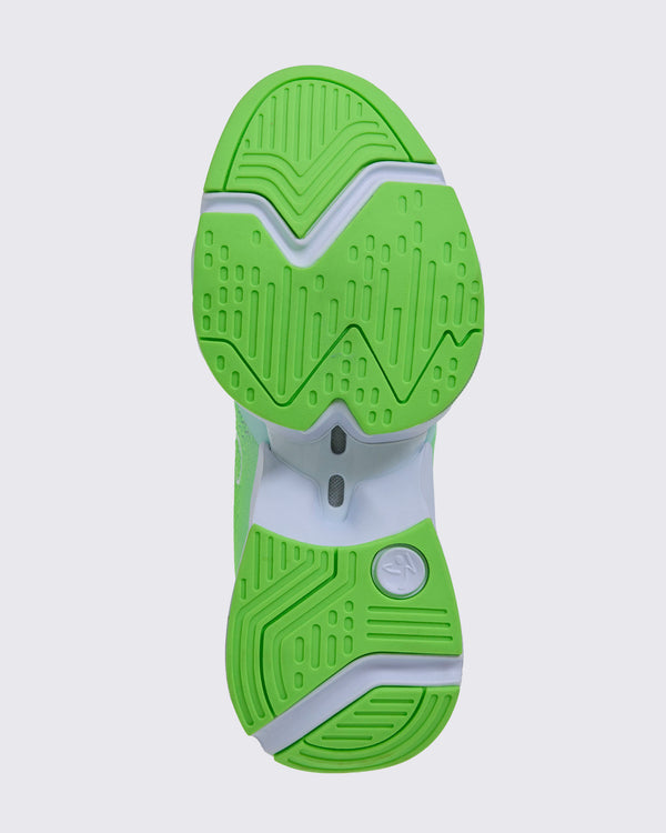 Sole view of a neon green sneaker's textured outsole with a Zumbito logo imprint on the upper heel.