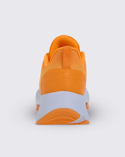 Heel view of the shoe, with a wavy textured orange heel panel, an orange pull tab with a Zumbito logo, and a thick white sole over orange tread.