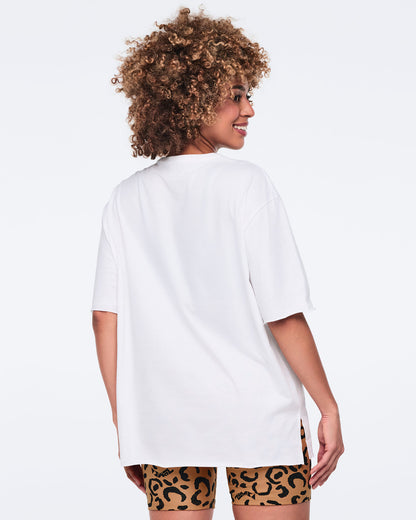 White oversized T-shirt, shown from the back on a female model wearing matching leopard-print biker shorts.
