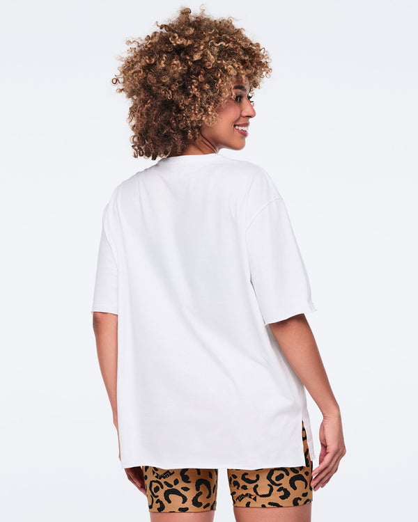 White oversized T-shirt, shown from the back on a female model wearing matching leopard-print biker shorts.