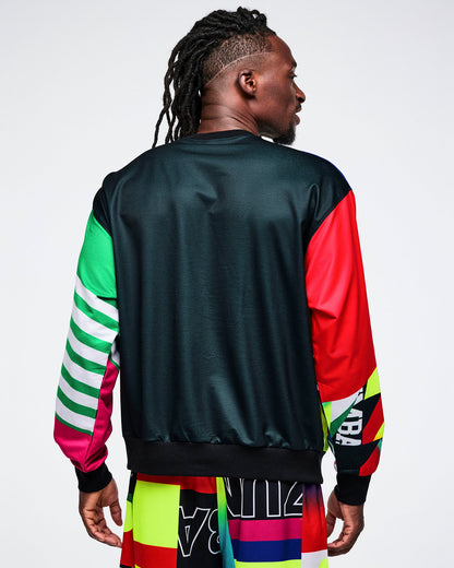Back view of a male model in a black top with colorful sleeves, set against a white background.