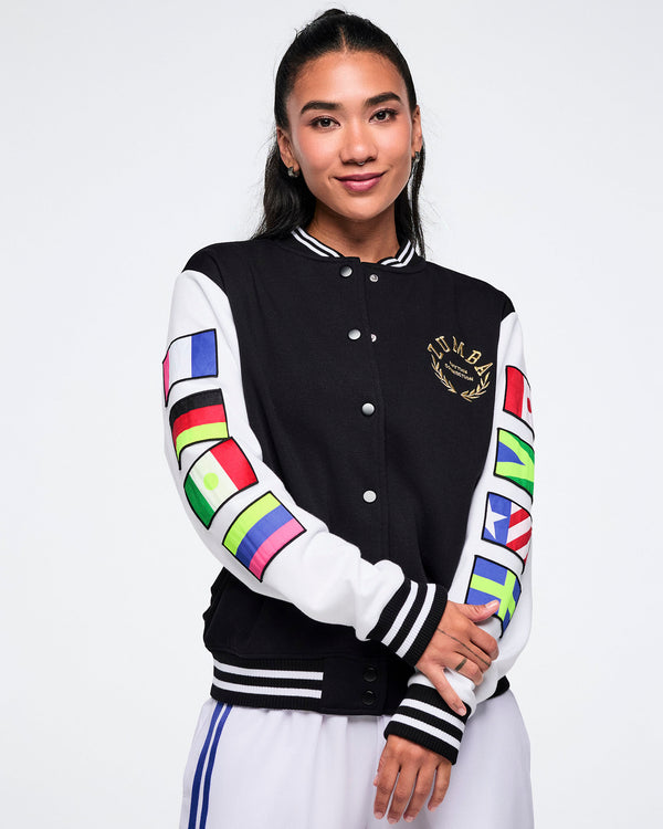 Female model wearing a black varsity jacket showing off the colorful flag sleeve designs.