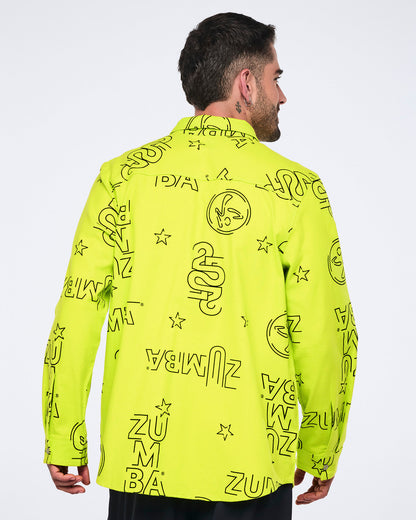 Neon green long-sleeve button-down shirt with black allover Zumba logo print. Male model wears the relaxed collared shirt with black pants, shown from the back against a light gray background.