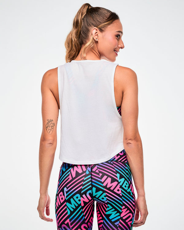 Shown from the back, female model wearing a white cropped tank, paired with blue and pink striped 