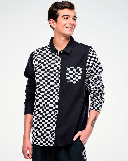 Male model wearing a black and white checkered flannel button-up with a chest pocket.