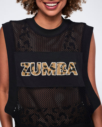 Black sleeveless mesh top with a sheer finish, wide arm openings, and bold leopard-print “Zumba” lettering across the chest, shown in close-up on a smiling female model.