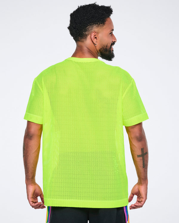 Back view of a male model wearing a bright yellow mesh top on a white background.