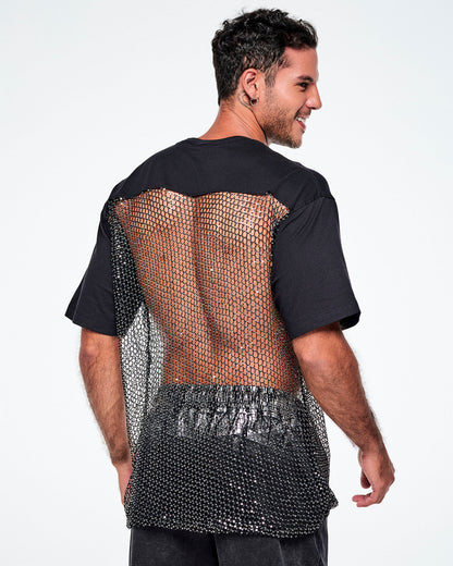 A male model shown from the back wearing a black tee, with a larger mesh and chain-link sheer mesh panel with sequins covering most of his back, paired with black pants.