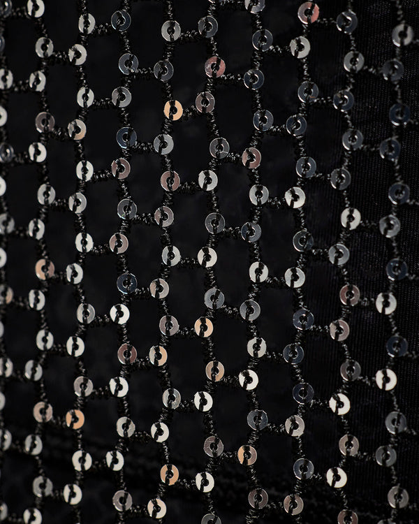 Close-up of the black sheer mesh panel with sequins, showing the chain-link pattern and the shimmering silver pattern.