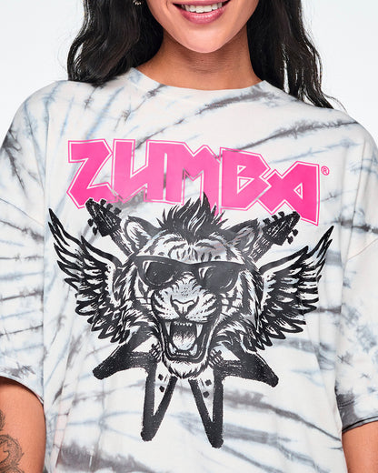 Close-up of the pink 'ZUMBA' rock-like text and a black and white image of a tiger in sunglasses with guitars and angel wings behind.

