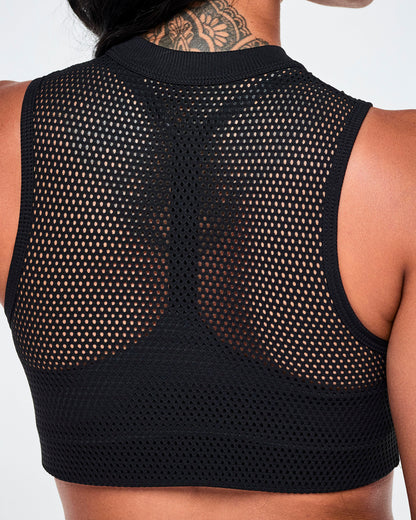 Close-up back detail of the black double-layer mesh Dale-Z crop bra, showing slim-fit mesh paneling over the inner layer and ribbed neckline.