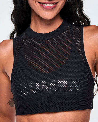 Close-up front detail of the black double-layer mesh Dale-Z crop bra, showing the silver "ZUMBA" logo on the inner layer visible through the outer mesh.