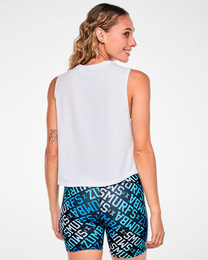 Back view of a female model in the white Smurfs graphic muscle tank, with a plain back and a slightly curved hem.