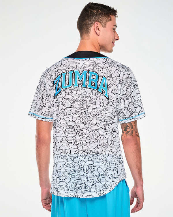 Back view of a male model in the white Smurfs line-art baseball jersey, showing arched light blue varsity 'ZUMBA' text outlined in black across the upper back, a rounded hem, and light blue stitching at the sleeve hems.