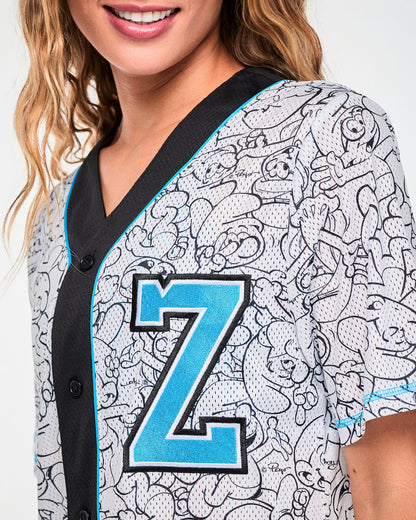 Close-up of the jersey's embroidered light blue 'Z' with black and white outlines, set on the white mesh beside the black placket, light blue piping, and black buttons.
