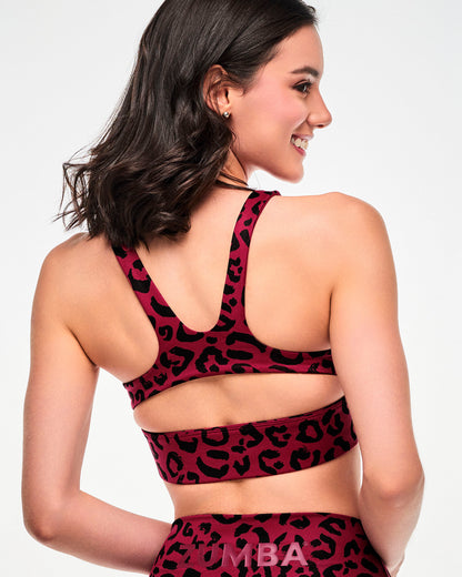Close-up back view of the dark red leopard print bra, showing the racerback straps and keyhole cutout above the underband.