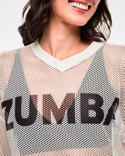 Close-up of the white mesh, the black 'ZUMBA' text near the V-neckline, female model.