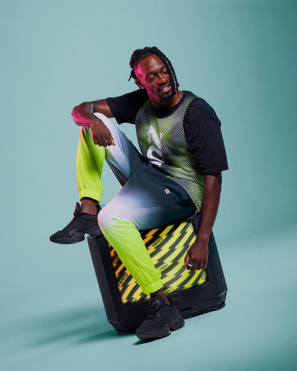 Male model wearing green and black dot 