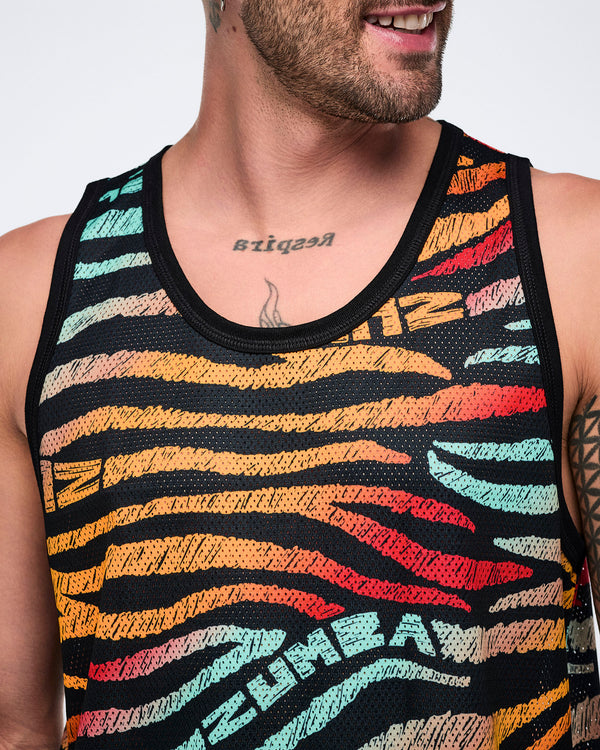 Male model wearing a sleeveless mesh tank in a black zebra-stripe print with multicolor brushstroke stripes in mint, yellow, orange, red, and beige, featuring black trim at the neckline and armholes.