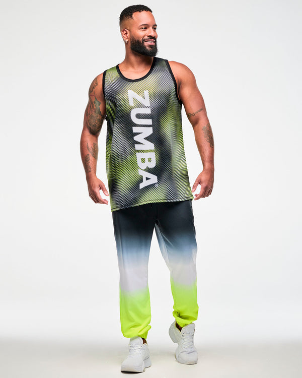 Full view of a male model wearing a black and yellow halftone dot-print tank top with white 