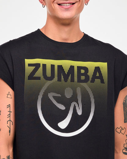 Close-up of a male model wearing a black cap-sleeve tee with a yellow-to-white gradient "ZUMBA" logo and Zumbito graphic.
