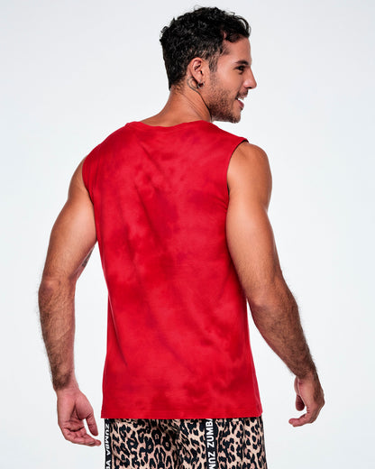 Back view of a male model wearing a red tank top, paired with tan leopard print shorts.