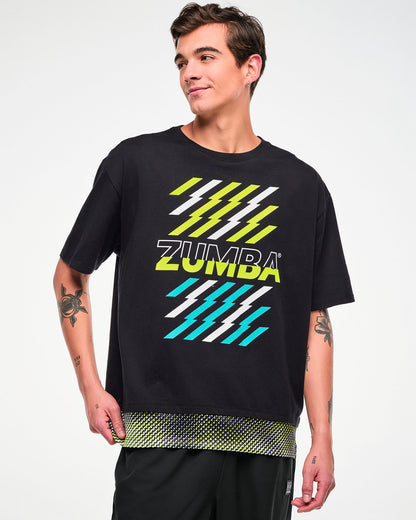 Male model wearing a black oversized T-shirt with yellow and aqua lightning graphics and a mesh dot-print hem.