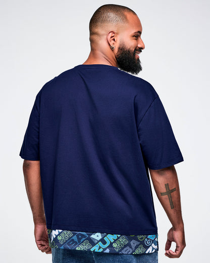 Back view of a male model wearing a blue 'Zumba' t-shirt.