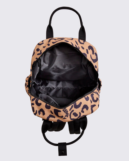 Open leopard-print Zumba backpack showing a spacious black-lined interior with a wide zip-around opening, black handles, and visible shoulder straps against a light gray background.