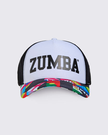 White Zumba cap with black 'Zumba' text with colorful brim on a light gray background.