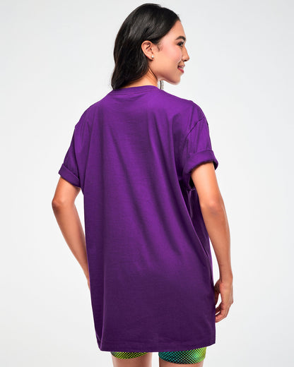 Shown from the back, female model wearing a purple T-shirt with sleeves rolled up.