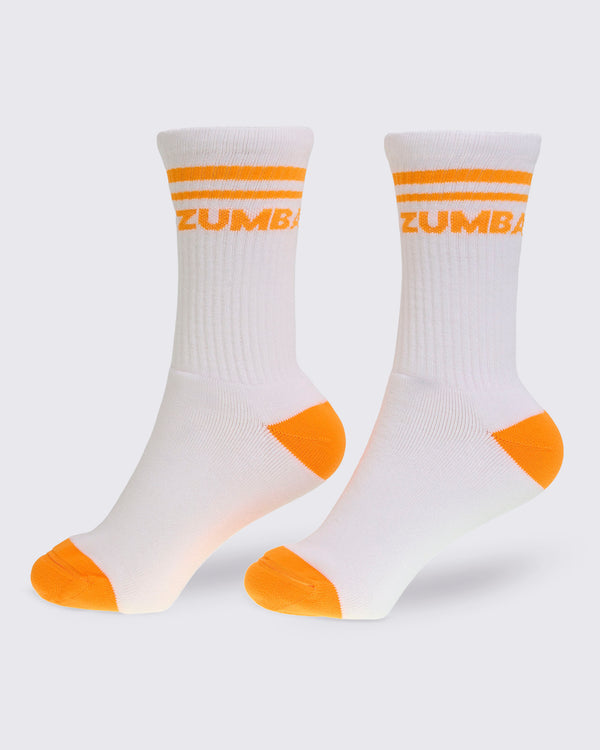 White crew socks featuring orange stripes, an orange heel and toe, and orange 
